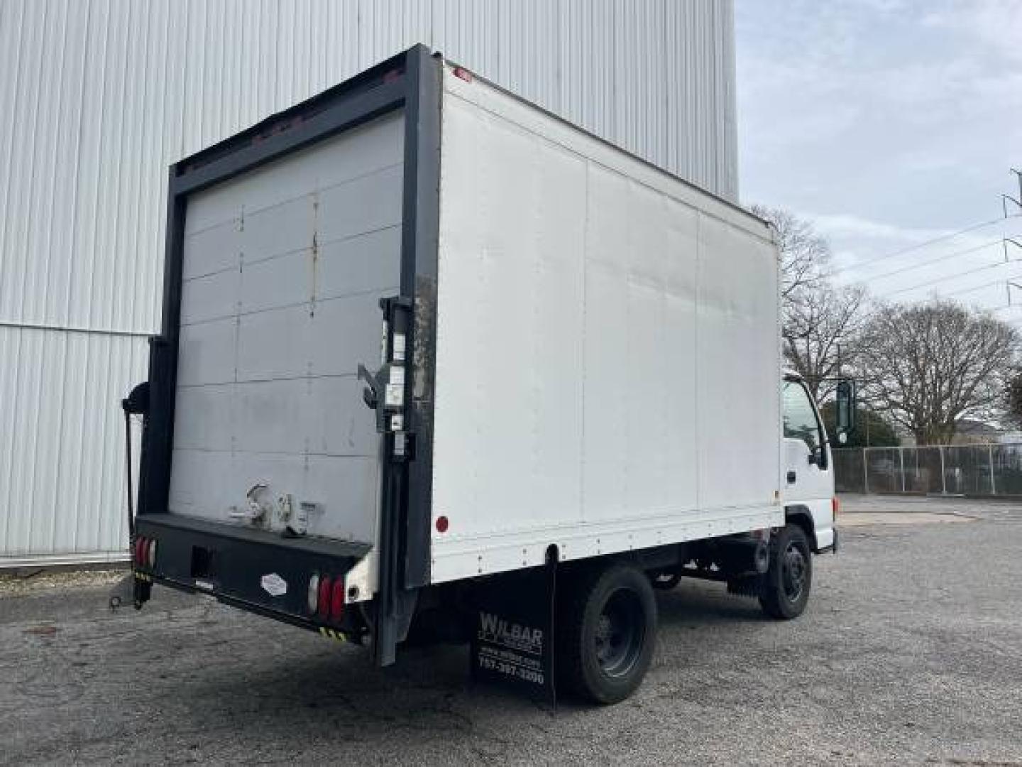 1999 white /gray Isuzu NPR (4KLC4B1R8XJ) with an 5.7 GAS V8 engine, Auto transmission, located at 5700 Curlew Drive, Norfolk, VA, 23502, (757) 455-6330, 36.841885, -76.209412 - -1999 Isuzu NPR 61k -Ready to work! -V8 gas motor -6 like new tires with great tread -12 ft box with roll up door -Tommy gate has been removed -No issues, runs and drives great -New state inspection -VADLR $250 processing fee. No other dealer fees. - Photo#8